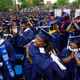 Avielle D. Watkins give a hug to a fellow student as members of the Class of 2014 celebrate during the graduation ceremony at Howard University in Washington, D.C., on May 10, 2014.